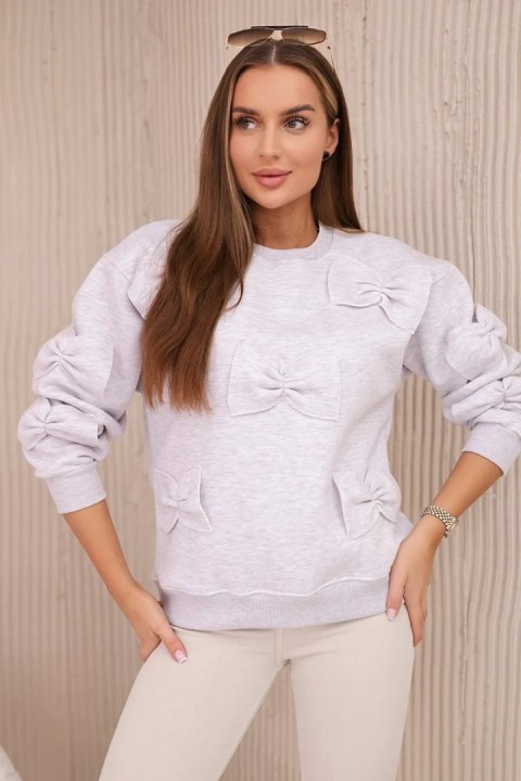 Bluza ocieplana ze ściągaczem i ozdobnymi kokardami beżowy melanż  
