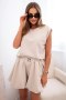 Komplet damski masełko z bluzką bez rękawów i szortami z szeroką nogawką beżowy  