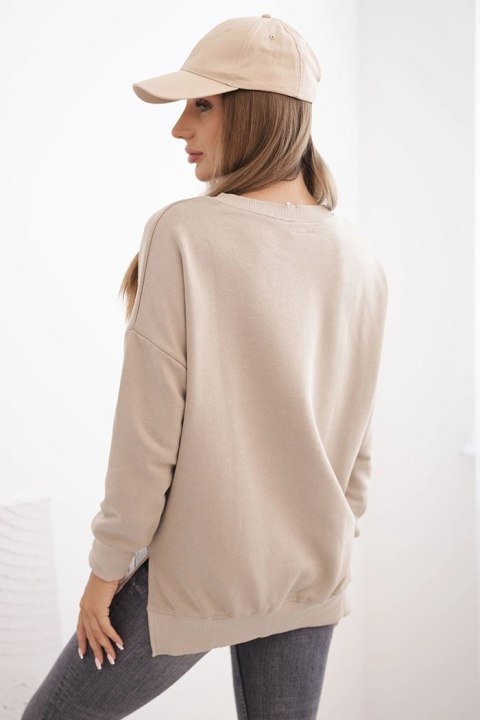 Bluza damska oversize z długim rękawem jasno beżowa Bluza damska oversize z długim rękawem jasno beżowa