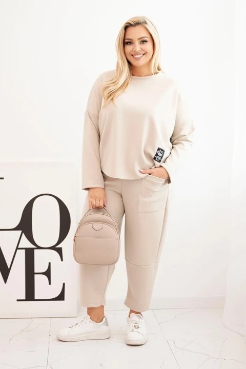 Komplet damski Plus Size masełko bluza i spodnie z kieszeniami beżowy Komplet damski Plus Size masełko bluza i spodnie z kieszeniami beżowy