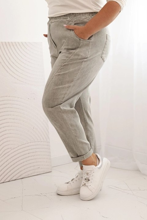 Spodnie damskie dekatyzowane Plus Size z gumką i kieszeniami beżowe Spodnie damskie dekatyzowane Plus Size z gumką i kieszeniami beżowe