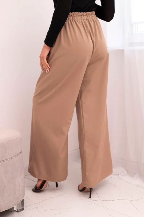 Spodnie damskie eleganckie z szeroką nogawką i ozdobnym kwiatem fango