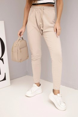 Spodnie damskie dresowe z elastycznym pasem i troczkiem beżowe