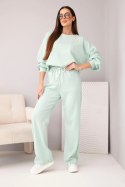 Komplet damski masełko bluza z broszką i spodnie z prostą nogawką ciemny miętowy