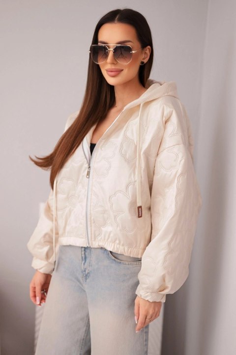 Kurtka damska pikowana z kapturem i ozdobnym tłoczeniem kwiatowym beżowa